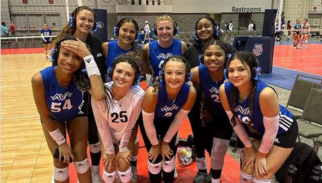 Girls volleyball team posing in Silent Sound System headphones